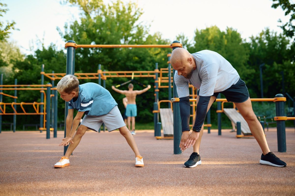 Dad and son doing exercise, sport training
